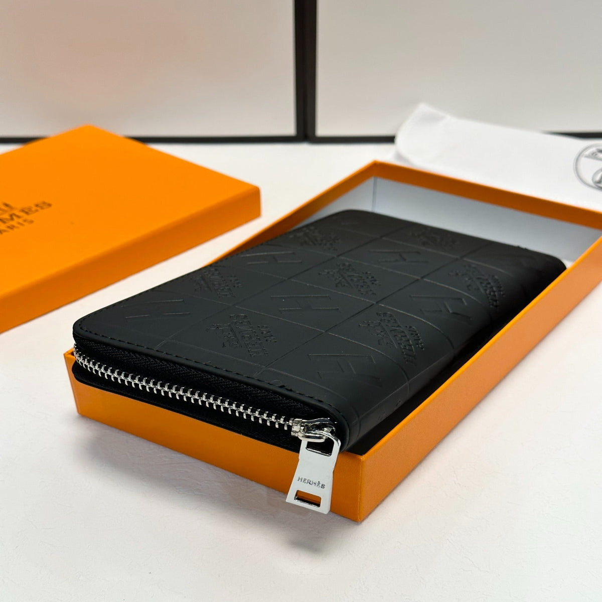 Hermès Black Embossed Leather Clutch
