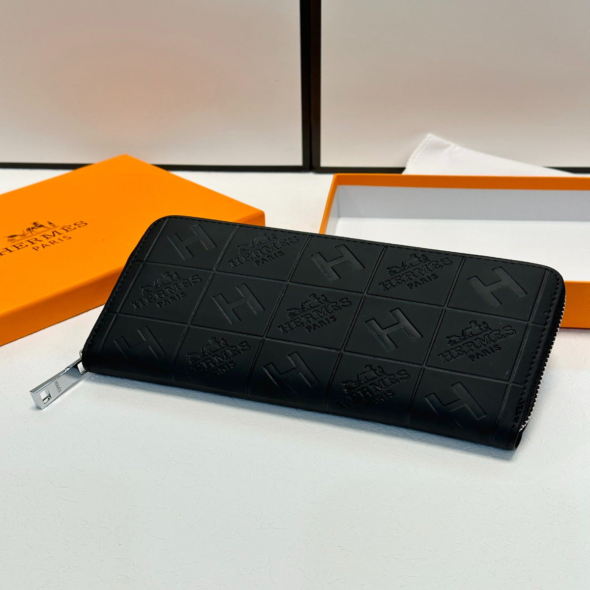 Hermès Black Embossed Leather Clutch