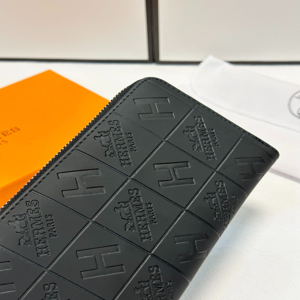 Hermès Black Embossed Leather Clutch