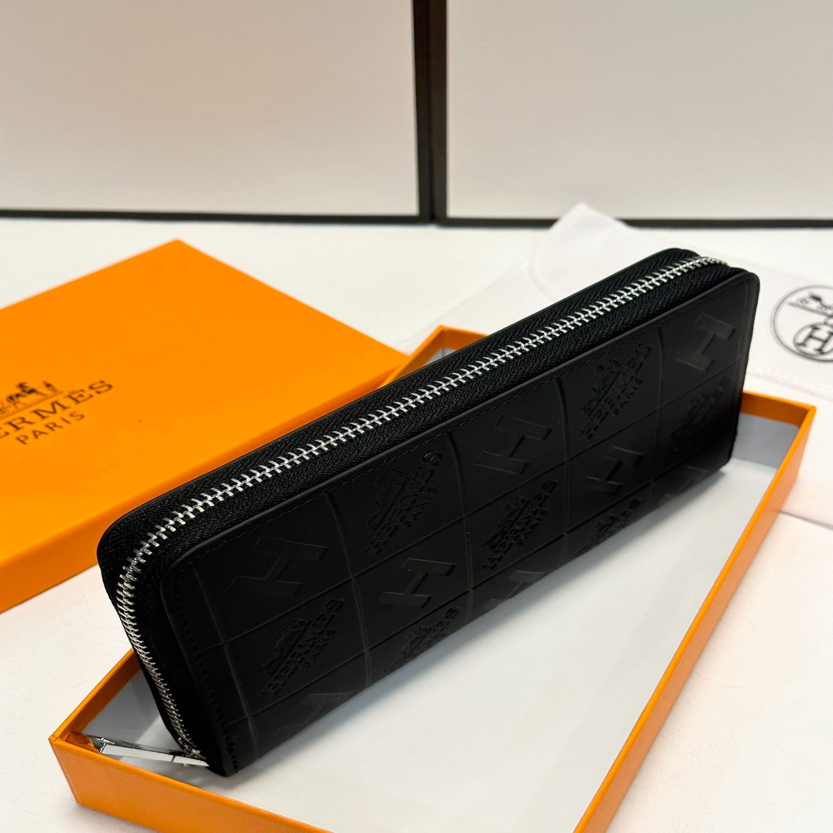 Hermès Black Embossed Leather Clutch
